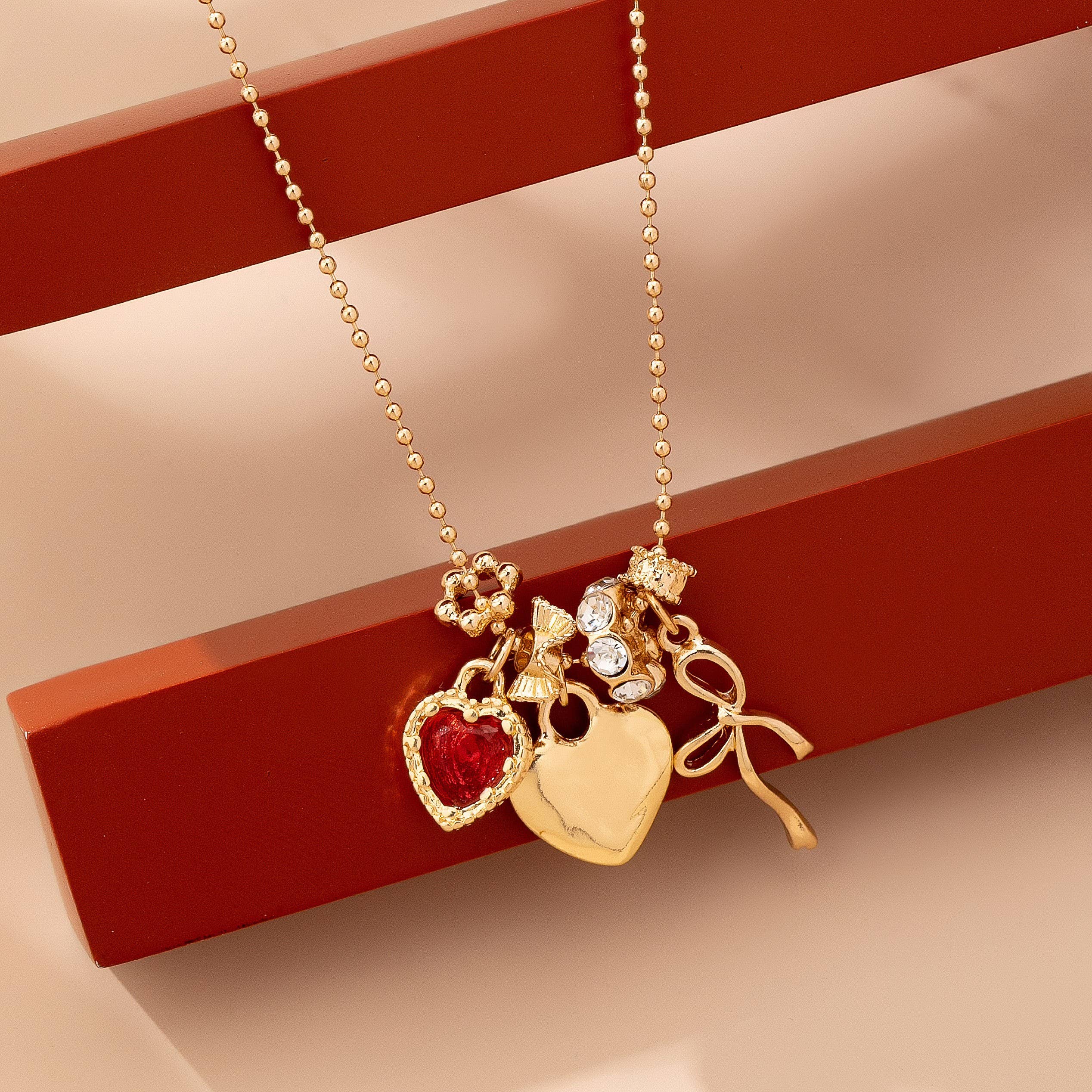 Multi-Charm Heart and Bow Necklace