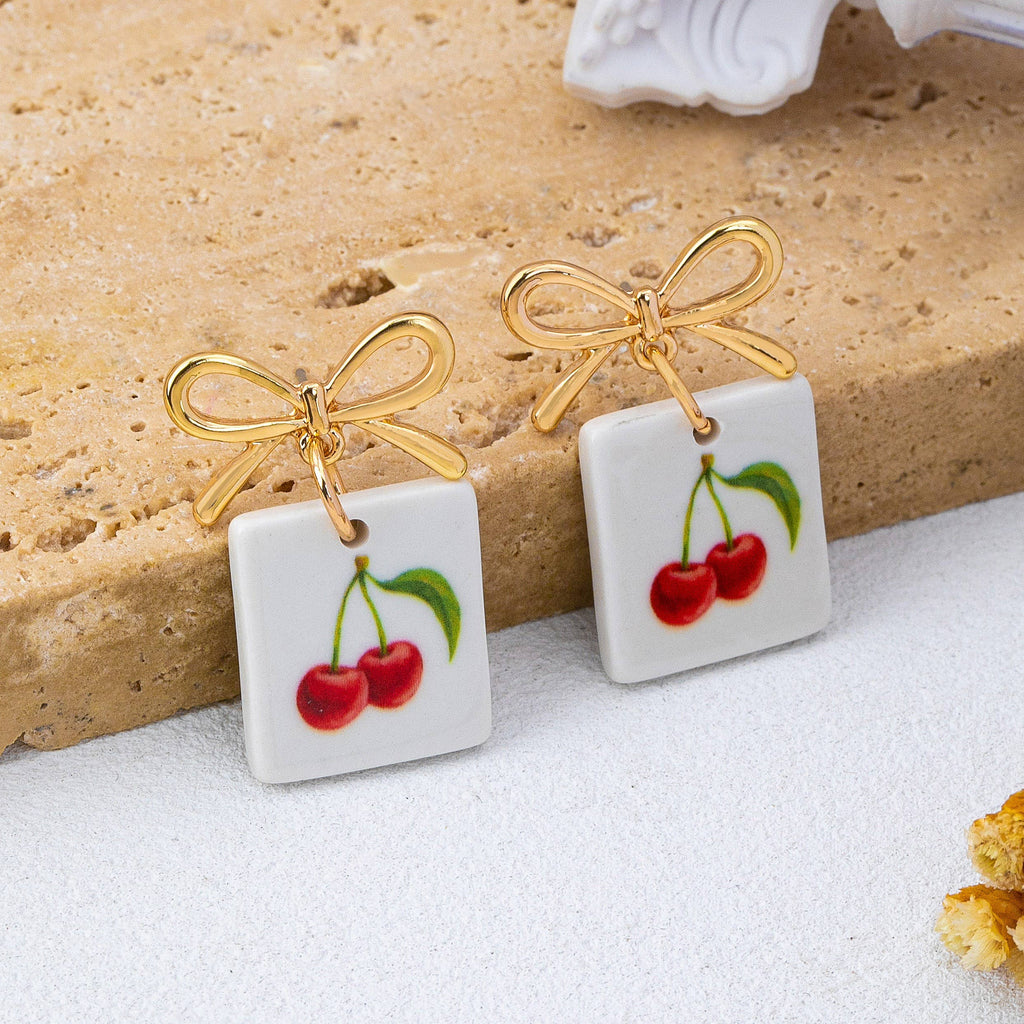 Gold Bow Drop Charm Earrings