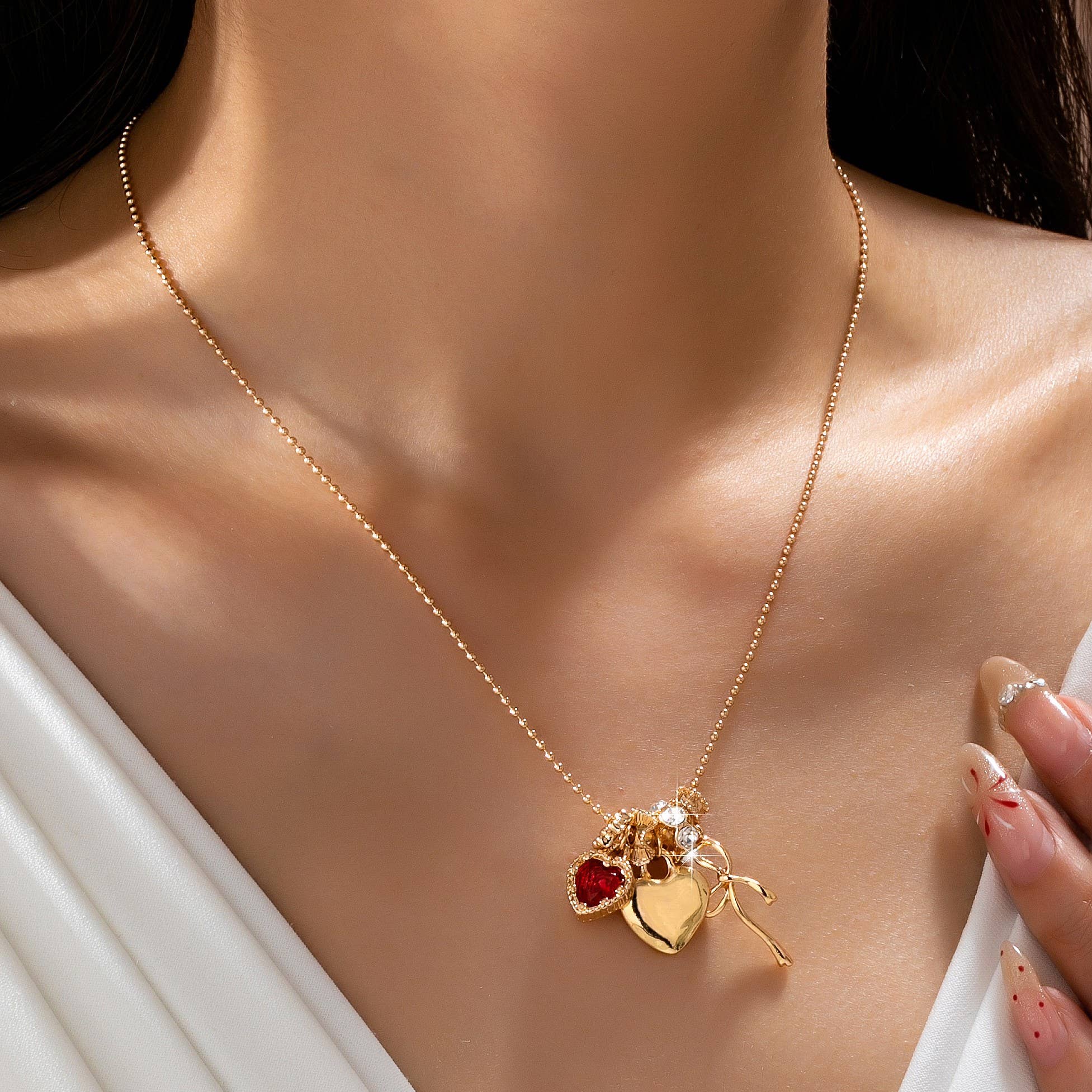 Multi-Charm Heart and Bow Necklace
