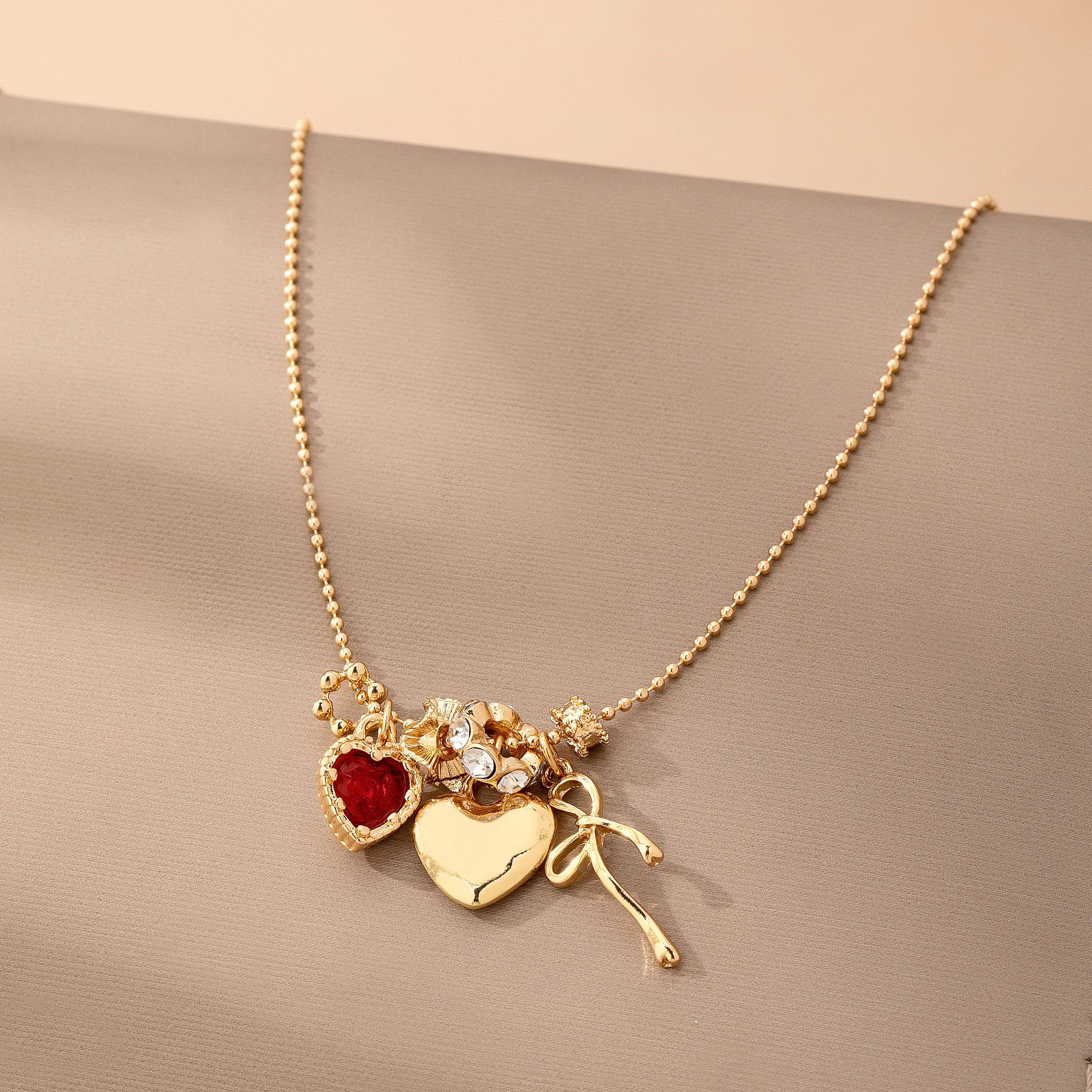 Multi-Charm Heart and Bow Necklace