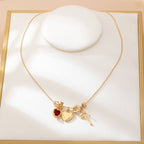Multi-Charm Heart and Bow Necklace