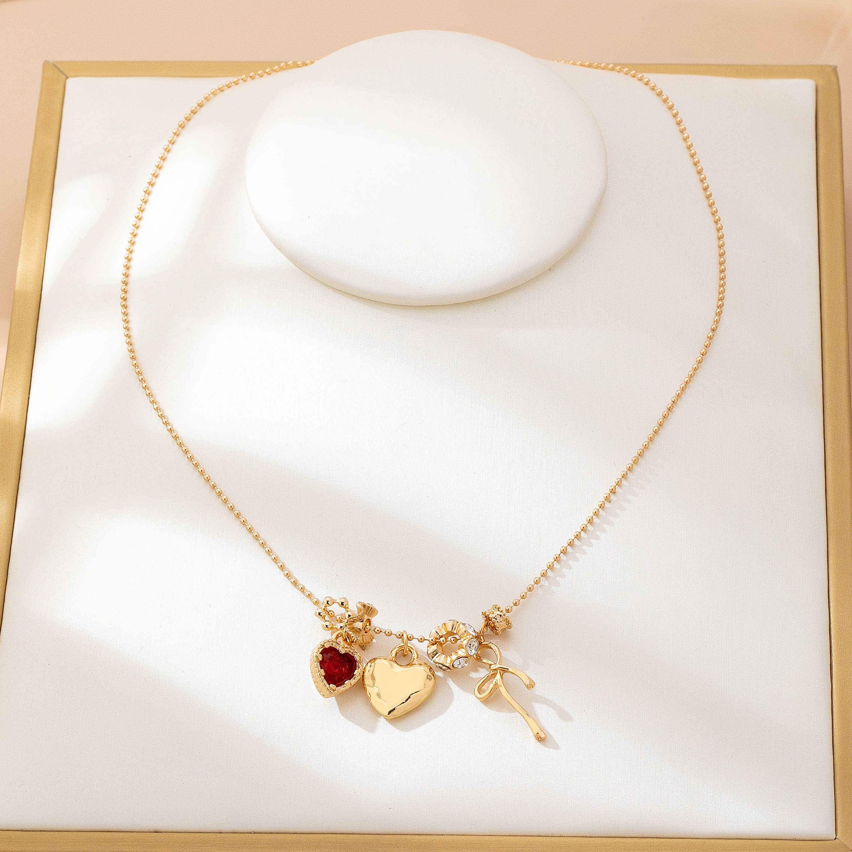 Multi-Charm Heart and Bow Necklace