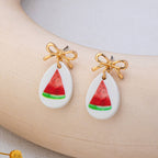 Gold Bow Drop Charm Earrings